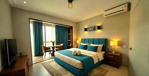 En eller flere senge i et værelse på Pyramids & Museum Way Hotel