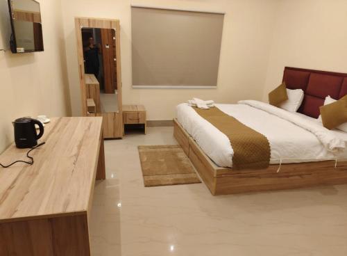 Giường trong phòng chung tại Hotel SJ corporate