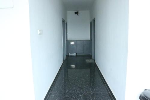 a corridor of a building with at JayPriya Residency in Kanipakam