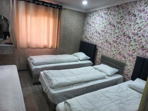 Postel nebo postele na pokoji v ubytování Minor Hotel