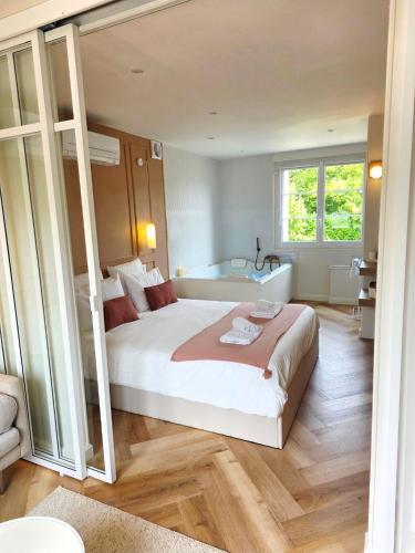 En eller flere senge i et værelse på Le Boudoir d'Elba - Balneotherapie & terrasse