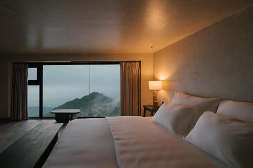 Ένα ή περισσότερα κρεβάτια σε δωμάτιο στο TOKI Boutique Hotel Tam Đảo