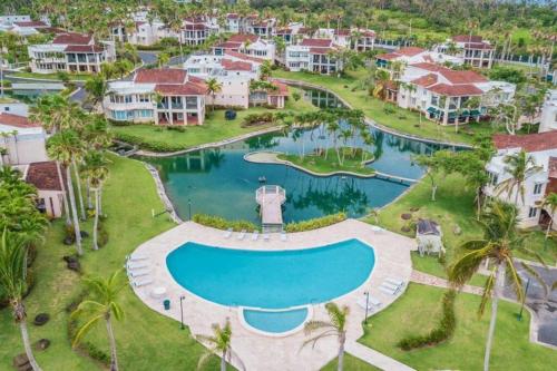 an aerial view of a resort with a swimming pool at Daria Beachfront community steps 2 pool- Generator in Brenas