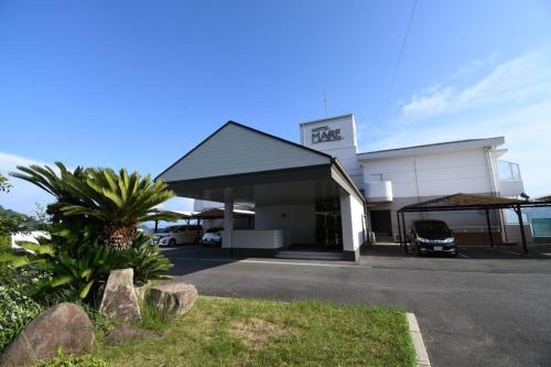 a building with a car parked in front of it at Hotel Mare - Vacation STAY 96730v in Kure