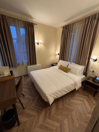 Postel nebo postele na pokoji v ubytování Μaissance