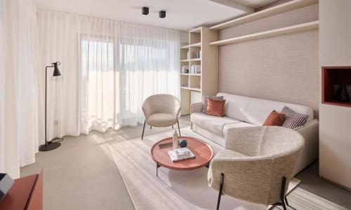 En eller flere senge i et værelse på Aminess Younique Vollo Residence