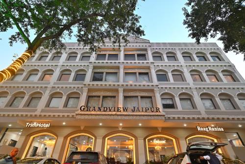 a large white building with a sign on it at TrimHotel Grandview Jaipur in Jaipur