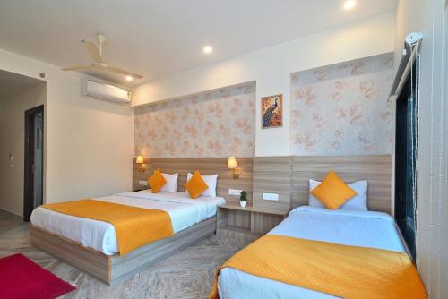 Voodi või voodid majutusasutuse TrimHotel Grandview Jaipur toas