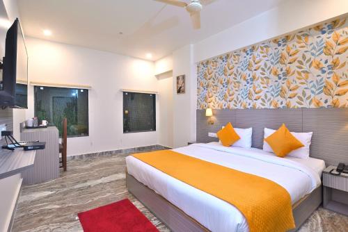 Voodi või voodid majutusasutuse TrimHotel Grandview Jaipur toas