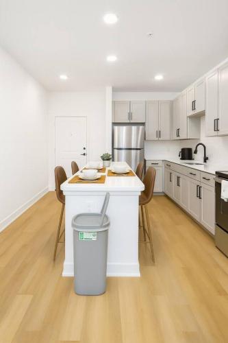 a kitchen with a island with a trash can at Relaxing 1BR escape worker friendly A plus Location in Sherman