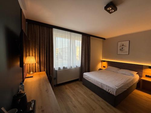 Postel nebo postele na pokoji v ubytování Hotel Martex