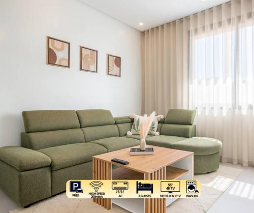 a living room with a couch and a coffee table at Cactus Apartment - Walk to Surf Beaches, Rooftop View, Remote Work, Free Parking, AC in Agadir nʼ Aït Sa