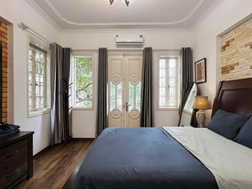 Ένα ή περισσότερα κρεβάτια σε δωμάτιο στο Ngao Home Nghi Tam