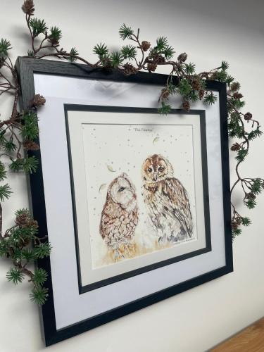 a framed drawing of two owls on a wall at Tawny Lodge, Evesham Nr Cotswolds in Evesham