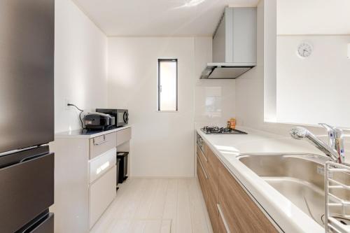 Køkken eller tekøkken på Ganadan福岡南