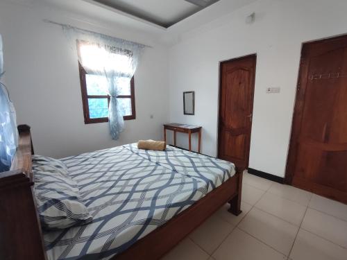 Postel nebo postele na pokoji v ubytování Kwa Mzungu Villa