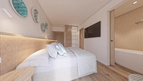 Ένα ή περισσότερα κρεβάτια σε δωμάτιο στο Hotel Moré