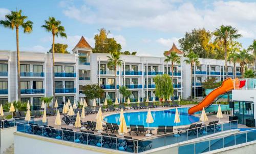 an image of a resort with a slide and a pool at Eflina Resort Hotel&Spa in Alanya