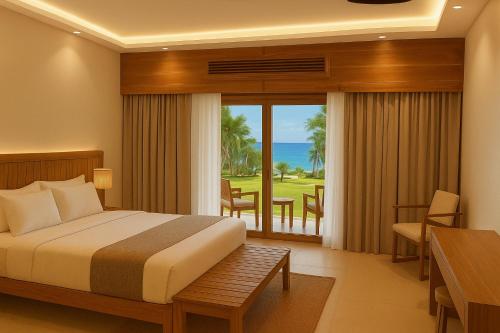 een slaapkamer met een bed en uitzicht op de oceaan bij JAZ Adonia in Uroa