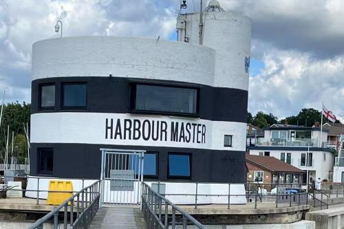 a lighthouse with the words harpoon master on it at River Studio Sleeps 2 with Parking & Dog Friendly in Southampton