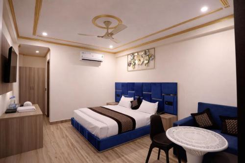 En eller flere senge i et værelse på Riverline Gold Resort