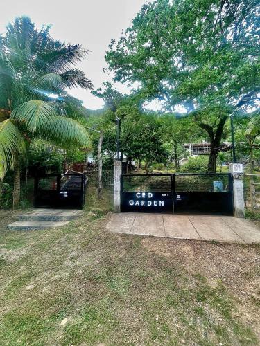 a sign that says get garden at a park at CED Garden in El Nido