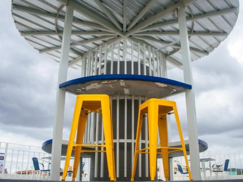 a observation tower on a cruise ship with two yellow at The Moon Hostel Huahin in Hua Hin