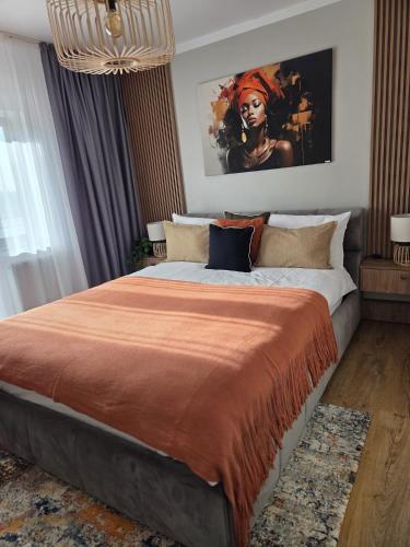 En eller flere senge i et værelse på ALiVA Stay Apartment