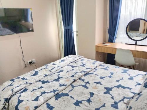 En eller flere senge i et værelse på City View Studio Apartement South Surabaya