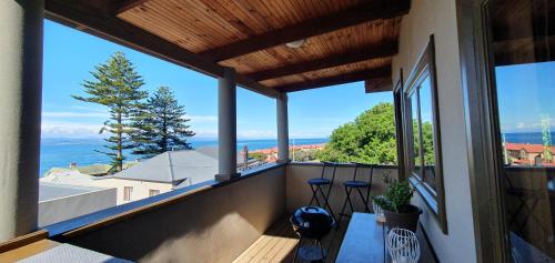 a balcony with a view of the ocean at 7 on Kloof in Mossel Bay