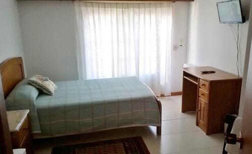 Hostal El Cairoにあるベッド