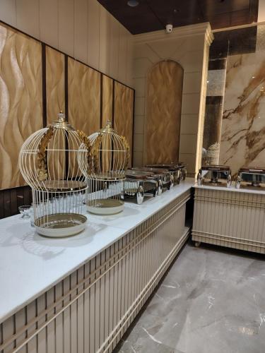 a buffet line with several dishes in metal cages at Hotel Northern Heights in Amritsar