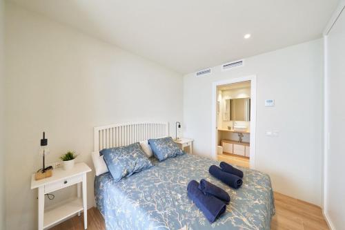 En eller flere senge i et værelse på Casa Surya