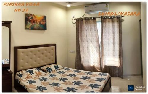 En eller flere senge i et værelse på Kiashna Villa 32