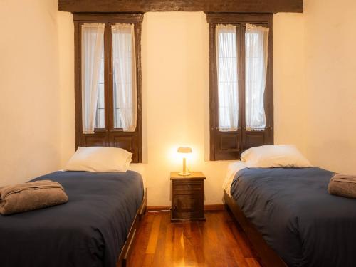 En eller flere senge i et værelse på Casa colonial en el corazón del Centro Histórico