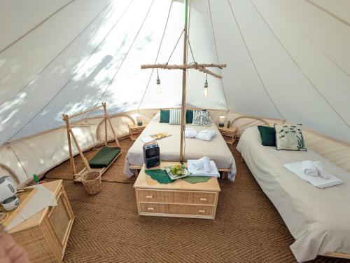 En eller flere senge i et værelse på I Giardini del Caramante