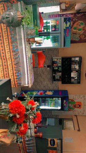 a view of a grocery store with flowers on a counter at MONIQUE CZ Maria Gléta in Abomey-Calavi