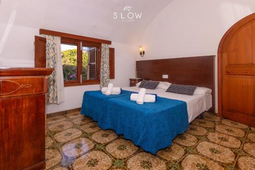 Postel nebo postele na pokoji v ubytování Villa Es Moli den Llull