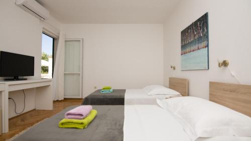 Postel nebo postele na pokoji v ubytování Villa Mandina - Makarska by Villas Guide