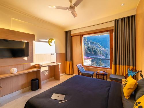 En eller flere senge i et værelse på The Hosteller Mcleodganj