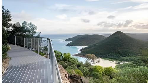 a view of the ocean from a glass house at Ebony & Ivory Villa in Nelson Bay