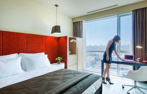 Una cama o camas en una habitación de Prima Link Hotel