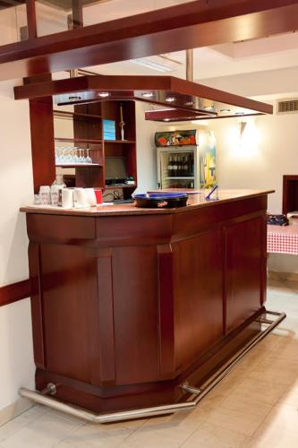 a kitchen with a wooden counter top in a room at Vila Lux Milikic in Kraljevo