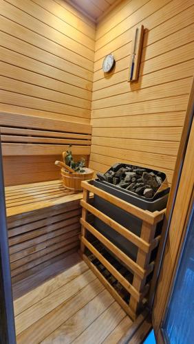 a room with a sauna with a stove in it at Recomeçar Guesthouse in Santa Cruz