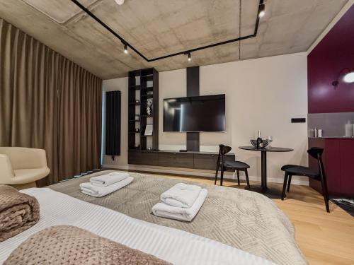 En eller flere senge i et værelse på Modern Apartment Gdańsk Luxury Stay