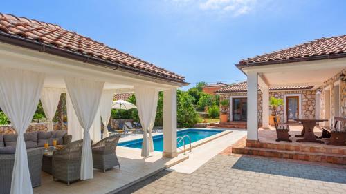 een afbeelding van een villa met zwembad bij Vila Gostinjac 2 with pool Krk by Villas Guide in Gostinjac