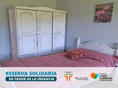 En eller flere senge i et værelse på Apartamentos La casa del Zapatero