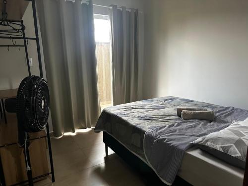 Giường trong phòng chung tại Sobrado Funcional da Sotero - boa localização