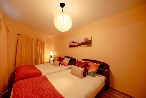 Giường trong phòng chung tại Powder Snow 粉雪