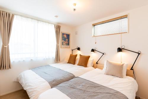 Ένα ή περισσότερα κρεβάτια σε δωμάτιο στο 4LDK Skytree Retreat